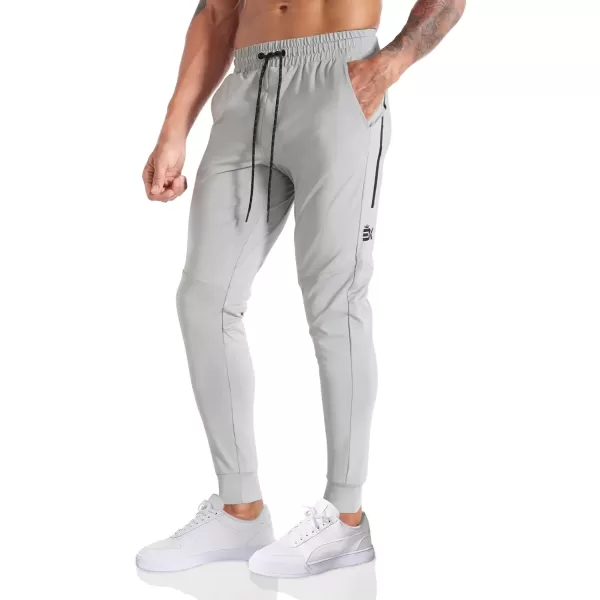 imageBROKIG Mens Lightweight Athletic Gym Jogger Pants Stretch Quick Dry Workout Running Sweat Pants with Zipper PocketsLight Gray