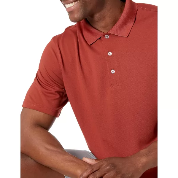 Amazon Essentials Mens RegularFit QuickDry Golf Polo Shirt Available in Big amp TallPolyester Rust