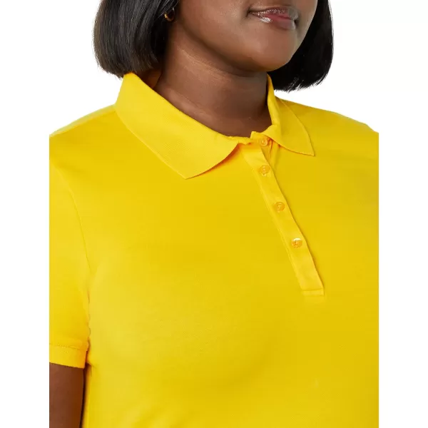 Amazon Essentials Womens ShortSleeve Polo Shirt Available in Plus SizeGolden Yellow