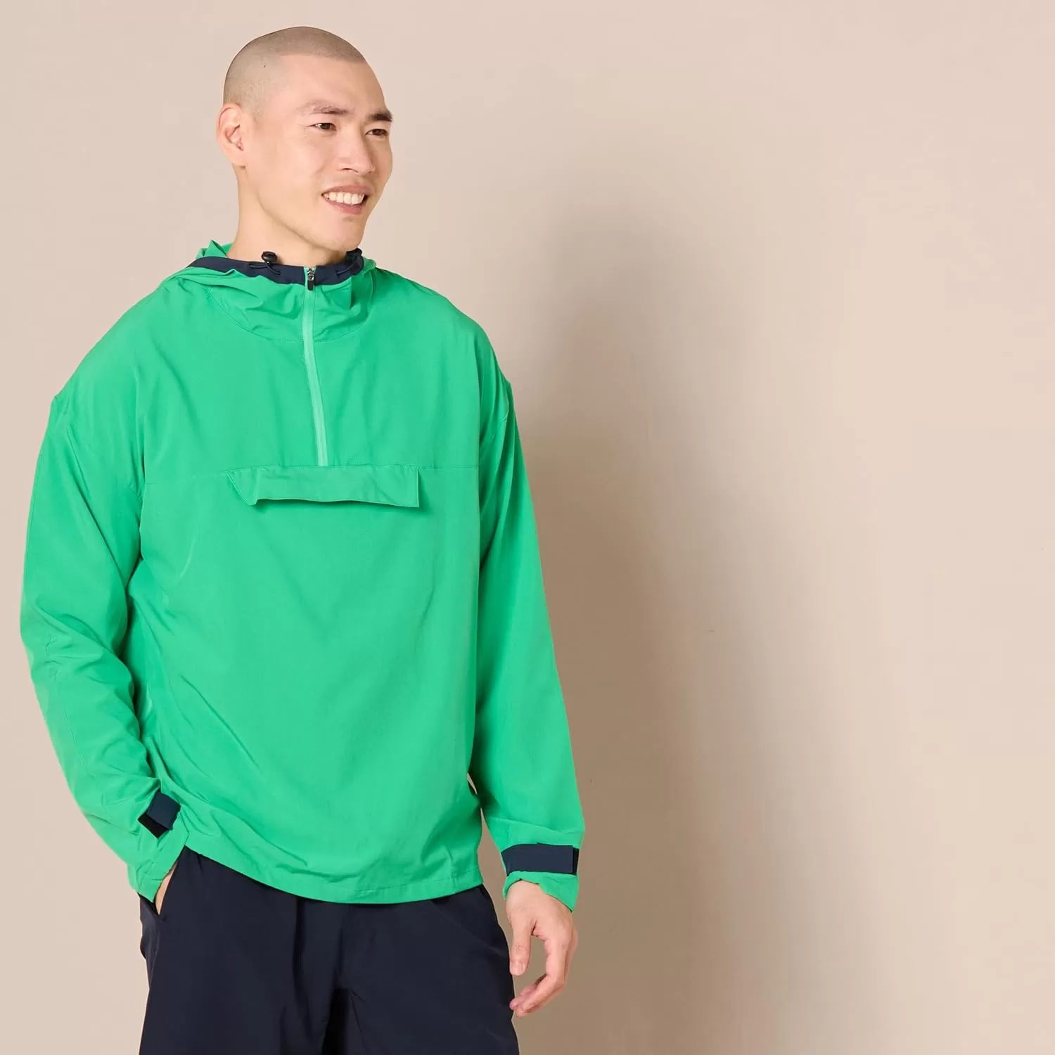 imageAmazon Essentials Mens Stretch Woven Quarter Zip Hooded Colorblock JacketGreen