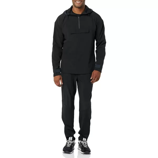 imageAmazon Essentials Mens Stretch Woven Quarter Zip Hooded Colorblock JacketBlack