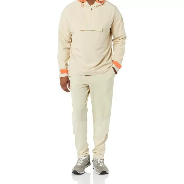 imageAmazon Essentials Mens Stretch Woven Quarter Zip Hooded Colorblock JacketStone