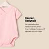 imageAmazon Essentials x Sofia Grainge Unisex Babies Side Snap Short Sleeve Bodysuit Pack of 3Delicate FloralIvoryPink