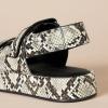 imageAmazon Essentials Womens Adjustable Triple Strap Flat Platform SandalMulti Faux Snake Skin