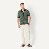 image:imageAmazon Essentials Mens RelaxedFit Short Sleeve ButtonDown Resort Knit Button Down ShirtDark Green Stripe Knit