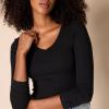 image:imageAmazon Essentials Womens SlimFit Long Sleeve VNeck Knit Rib Shirts Pack of 2Eggshell WhiteBlack