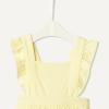 image:imageAmazon Essentials x Sofia Grainge Baby Girls Cotton Sleeveless Romper with RufflesLight Yellow