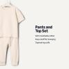 image:imageAmazon Essentials x Sofia Grainge Unisex Toddlers and Babies Cotton Knit Short Sleeve Shirt amp Pants SetIvory