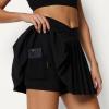 image:imageAmazon Essentials Womens Performance Stretch Woven Pleated Tennis Skirt with Builtin Shorts and PocketsBlack