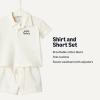 image:imageAmazon Essentials x Sofia Grainge Toddlers and Baby Boys Cotton Pique Short Sleeve Shirt amp Shorts Play SetIvory Navy Petit Soleil
