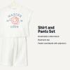 image:imageAmazon Essentials x Sofia Grainge Toddlers and Baby Girls Cotton Pique Short Sleeve TShirt amp Pants Play SetIvory Marine Club
