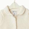 image:imageAmazon Essentials x Sofia Grainge Toddlers and Baby Girls Cotton Short Sleeve Button Front Sweater with Peter Pan CollarIvory
