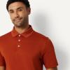 image:imageAmazon Essentials Mens Moisture Wicking Golf Polo Shirt Short Sleeve SlimFit QuickDryBrick Red