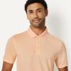 image:imageAmazon Essentials Mens Moisture Wicking Golf Polo Shirt Short Sleeve SlimFit QuickDryPale Peach