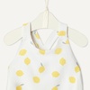 image:imageAmazon Essentials x Sofia Grainge Toddlers and Baby Girls OnePiece Swimsuit with Crisscross Straps Ruffle DetailIvory Lemon