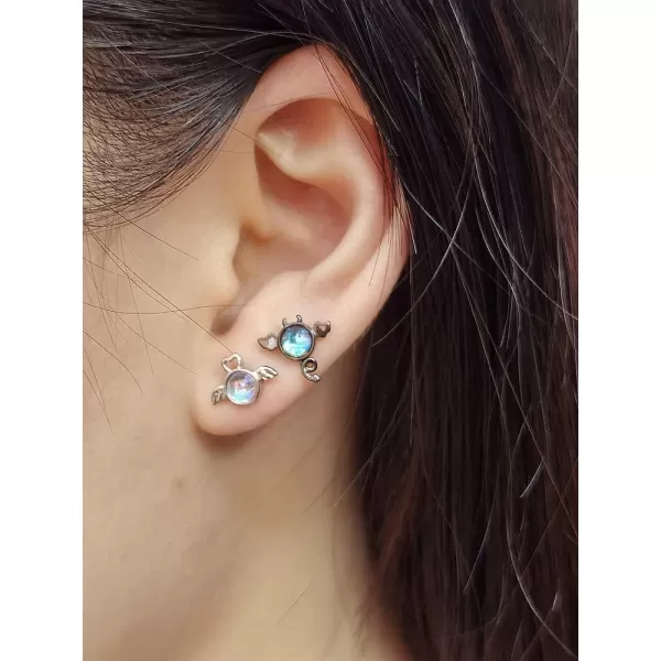 imageAsymmetrical Angel Evil Earrings 925 Sterling Silver Small Cute Love Heart Wings Cartilage Studs Earring for Women Imitation Moon Stone Mismatch White and Black Ear Jewelry Gifts for Daughter Niece