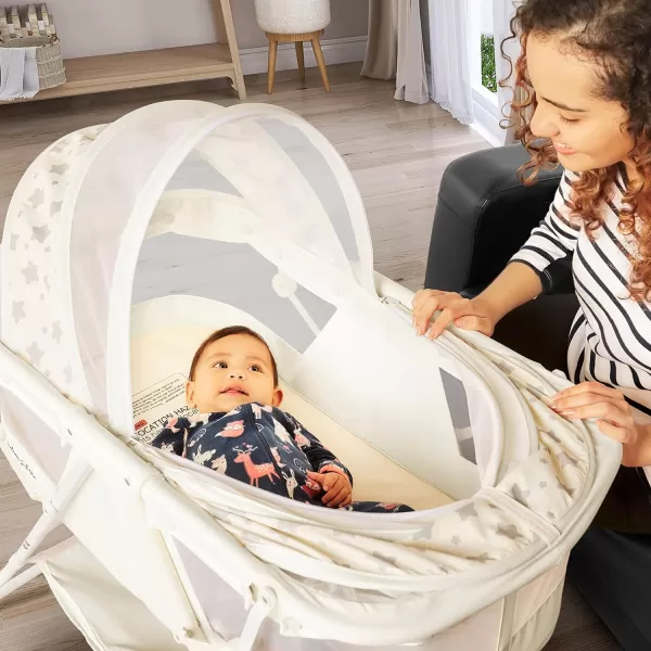 Karley Bassinet in Cool Grey, Lightweight Portable Baby Bassinet, Quick Fold and Easy to Carry , Adjustable Double Canopy, Indoor and Outdoor Bassinet with Large Storage Basket.