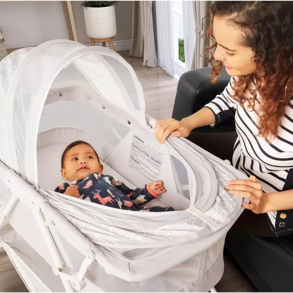 Karley Bassinet in Cool Grey, Lightweight Portable Baby Bassinet, Quick Fold and Easy to Carry , Adjustable Double Canopy, Indoor and Outdoor Bassinet with Large Storage Basket.