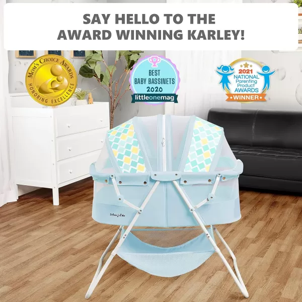 Karley Bassinet in Cool Grey, Lightweight Portable Baby Bassinet, Quick Fold and Easy to Carry , Adjustable Double Canopy, Indoor and Outdoor Bassinet with Large Storage Basket.