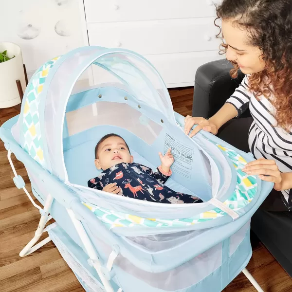 Karley Bassinet in Cool Grey, Lightweight Portable Baby Bassinet, Quick Fold and Easy to Carry , Adjustable Double Canopy, Indoor and Outdoor Bassinet with Large Storage Basket.