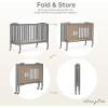 imageDream On Me Folding Full Size Convenience Crib In Storm Grey Two Adjustable Mattress Height Positions Comes With Heavy Duty Locking Wheels Flat FoldingStorm Grey
