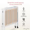 imageDream On Me 3 in 1 Portable Folding Stationary Side Crib in Steel Grey Greenguard Gold Certified Safety Wheels with Locking Casters Convertible 3 Mattress HeightsWhite