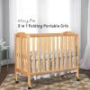 imageDream On Me 3 in 1 Portable Folding Stationary Side Crib in Steel Grey Greenguard Gold Certified Safety Wheels with Locking Casters Convertible 3 Mattress HeightsNatural