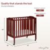 imageDream On Me 3 in 1 Portable Folding Stationary Side Crib in Steel Grey Greenguard Gold Certified Safety Wheels with Locking Casters Convertible 3 Mattress HeightsCherry