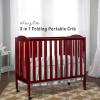 imageDream On Me 3 in 1 Portable Folding Stationary Side Crib in Steel Grey Greenguard Gold Certified Safety Wheels with Locking Casters Convertible 3 Mattress HeightsCherry