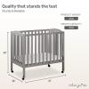 imageDream On Me 3 in 1 Portable Folding Stationary Side Crib in Steel Grey Greenguard Gold Certified Safety Wheels with Locking Casters Convertible 3 Mattress HeightsSteel Grey