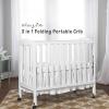 imageDream On Me 3 in 1 Portable Folding Stationary Side Crib in Steel Grey Greenguard Gold Certified Safety Wheels with Locking Casters Convertible 3 Mattress HeightsWhite