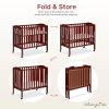 imageDream On Me 3 in 1 Portable Folding Stationary Side Crib in Steel Grey Greenguard Gold Certified Safety Wheels with Locking Casters Convertible 3 Mattress HeightsCherry