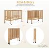 imageDream On Me Quinn FullSize Portable Baby Crib in White GreenGuard Gold ampamp JPMA Patented Quick Fold System Adjustable Mattress Support Smooth Wheels Compact Design Safe Sleep AssuranceNatural