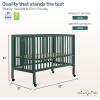 imageDream On Me Quinn FullSize Portable Baby Crib in White GreenGuard Gold ampamp JPMA Patented Quick Fold System Adjustable Mattress Support Smooth Wheels Compact Design Safe Sleep AssuranceOlive