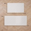 image:imageLaura Ashley HiLow Tufted 26 x 60 Washable SkidResistant Runner Rug  Dusty Navy Feya SolidAustell Solid Ivory